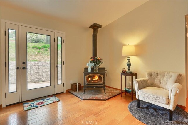 41820 Dillon Cir, Ahwahnee, CA 93601 - entryway featuring a wood stove, light wood-style floors, and baseboards