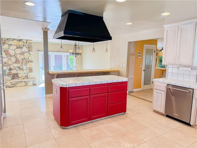 kitchen featuring stainless steel dishwasher, tile countertops, light tile patterned floors, island exhaust hood, and a kitchen island
