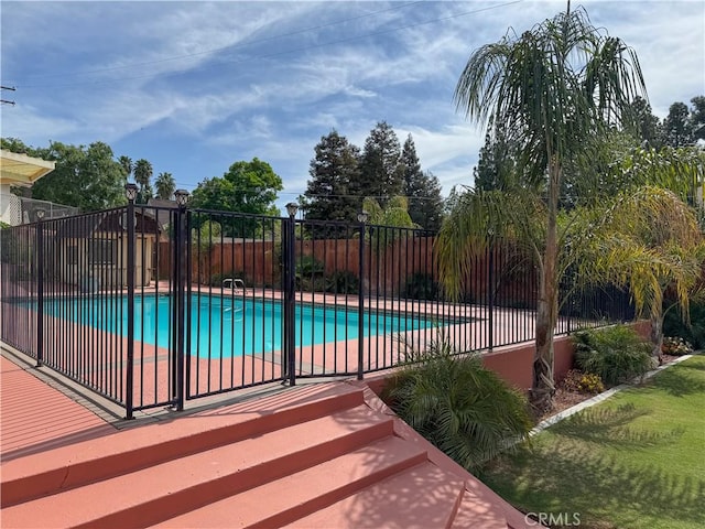 view of pool with fence and a fenced in pool
