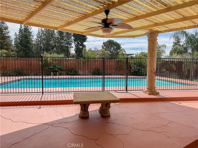 view of swimming pool featuring a pergola, a fenced in pool, fence, and a ceiling fan