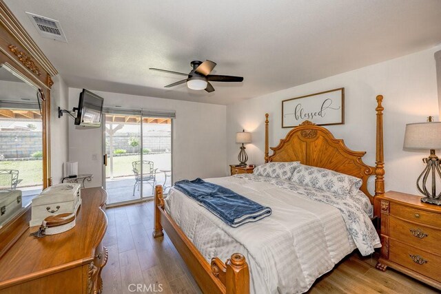 6030 Treehaven Ct, Lancaster, CA 93536 - bedroom featuring access to exterior, wood finished floors, and ceiling fan
