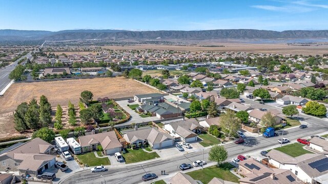 6030 Treehaven Ct, Lancaster, CA 93536 - aerial perspective of suburban area featuring a mountainous background