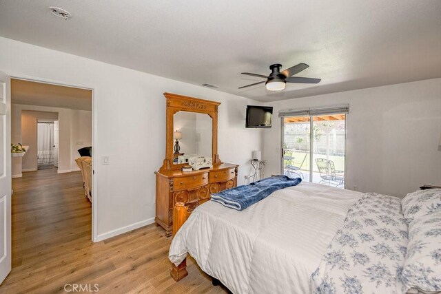 6030 Treehaven Ct, Lancaster, CA 93536 - bedroom with access to exterior, light wood finished floors, baseboards, and a ceiling fan