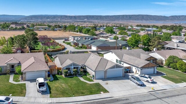 6030 Treehaven Ct, Lancaster, CA 93536 - aerial perspective of suburban area with a mountainous background