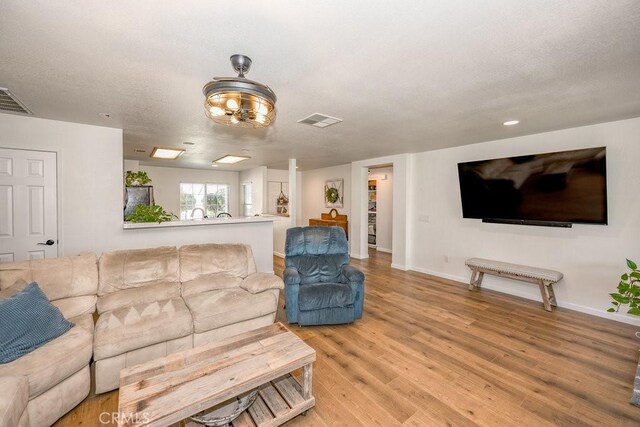 6030 Treehaven Ct, Lancaster, CA 93536 - living room with light wood finished floors and baseboards