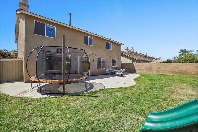 13608 Sagemont Ct, Eastvale, CA 92880 - rear view of house featuring stucco siding, a playground, a patio area, and a chimney