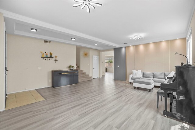 13608 Sagemont Ct, Eastvale, CA 92880 - living room featuring light wood finished floors, stairway, and recessed lighting