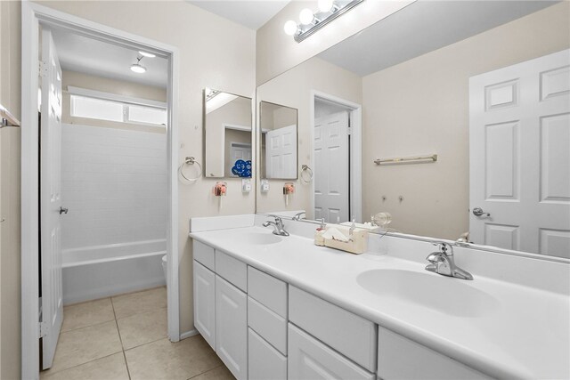 13608 Sagemont Ct, Eastvale, CA 92880 - full bath featuring double vanity, tile patterned floors, and  shower combination