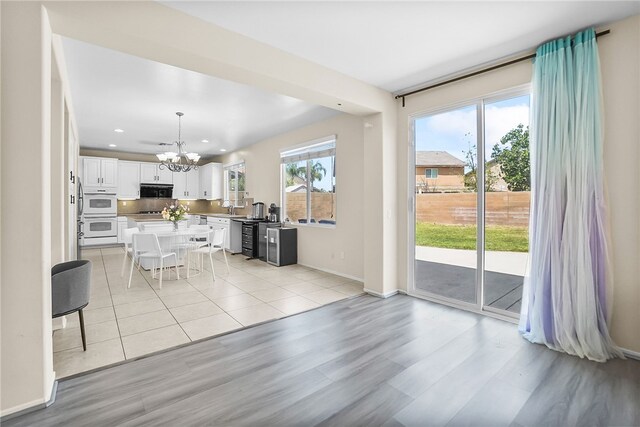 13608 Sagemont Ct, Eastvale, CA 92880 - living room featuring a chandelier, recessed lighting, and light wood-style floors