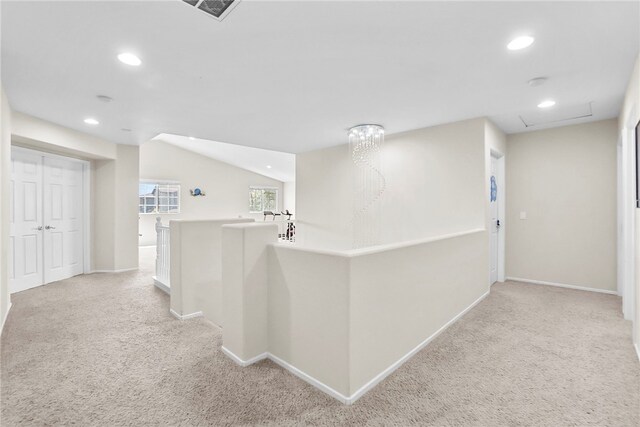 13608 Sagemont Ct, Eastvale, CA 92880 - hall with an upstairs landing, light colored carpet, and recessed lighting