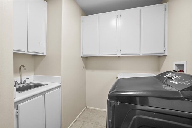 13608 Sagemont Ct, Eastvale, CA 92880 - laundry area featuring cabinet space, light tile patterned flooring, and washer hookup