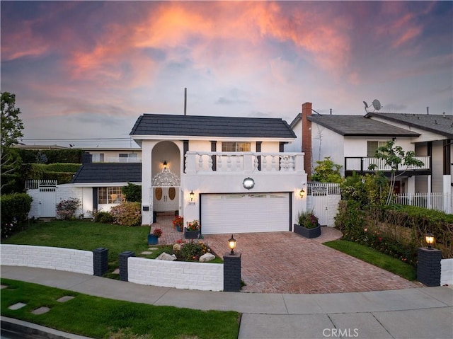 3010 Stoner Ave, Los Angeles, CA 90066 - front of property with an attached garage, fence, decorative driveway, and a balcony