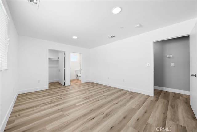 3721 S San Pedro St, Los Angeles, CA 90011 - unfurnished bedroom with recessed lighting, visible vents, light wood finished floors, and baseboards
