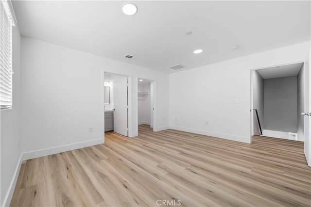 3721 S San Pedro St, Los Angeles, CA 90011 - unfurnished bedroom with visible vents, baseboards, recessed lighting, and light wood-style floors