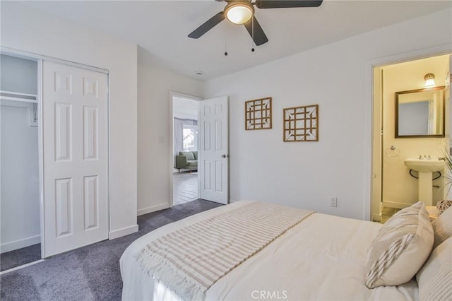 bedroom with a ceiling fan, connected bathroom, carpet floors, a closet, and baseboards