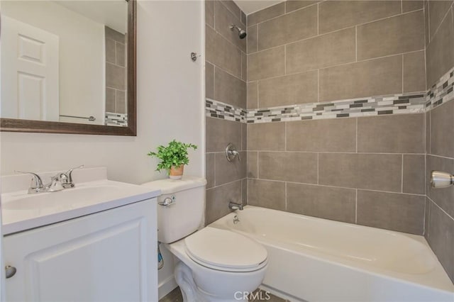 full bathroom featuring toilet, vanity, and washtub / shower combination