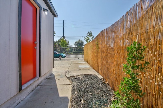 view of side of property featuring fence