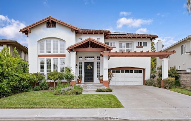 mediterranean / spanish home with roof mounted solar panels, concrete driveway, a front lawn, and stucco siding