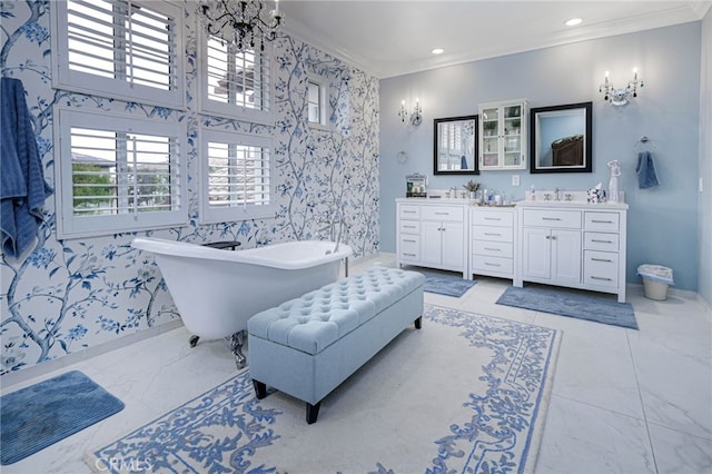 full bathroom featuring wallpapered walls, vanity, ornamental molding, baseboards, and a soaking tub