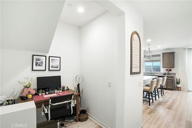 office area with light wood-type flooring, recessed lighting, and baseboards