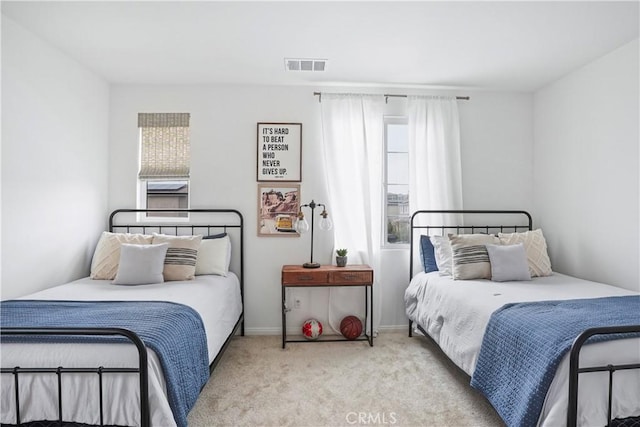 carpeted bedroom with visible vents