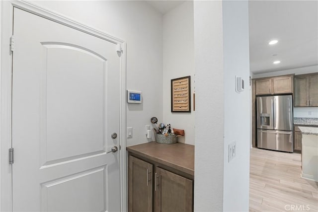 doorway to outside featuring recessed lighting and light wood-style floors