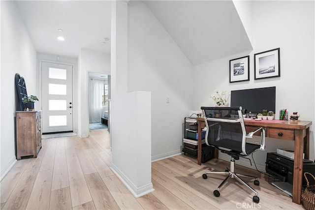 office area featuring light wood-style floors and baseboards