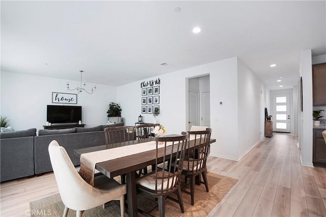 dining area with recessed lighting, a chandelier, light wood finished floors, and visible vents