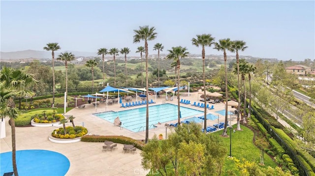 community pool featuring a patio area
