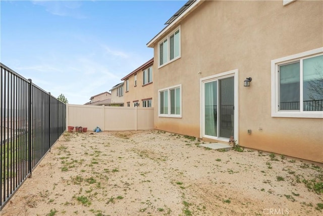 exterior space with a fenced backyard