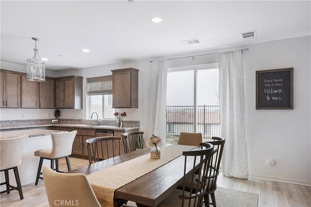 dining space with baseboards, recessed lighting, light wood-style flooring, and visible vents