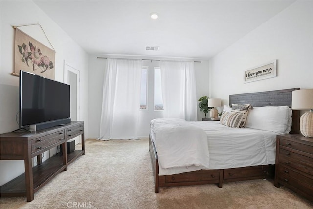 bedroom featuring carpet floors and visible vents