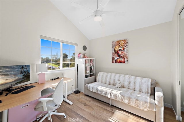 office featuring baseboards, wood finished floors, high vaulted ceiling, and ceiling fan