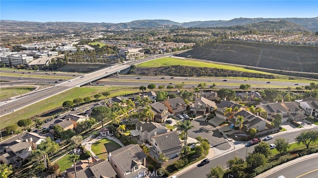 birds eye view of property featuring a mountain view and a residential view