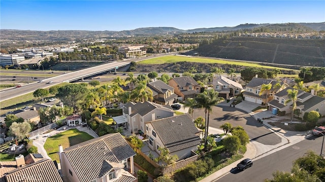 drone / aerial view featuring a mountain view and a residential view