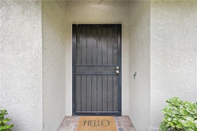 1061 Pebble Beach Dr, Upland, CA 91784 - property entrance with stucco siding