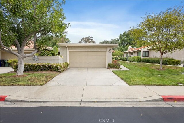 1061 Pebble Beach Dr, Upland, CA 91784 - view of front of house featuring a front lawn and stucco siding