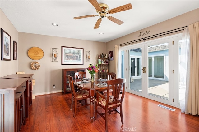 dining area featuring recessed lighting, wood finished floors, visible vents, french doors, and baseboards