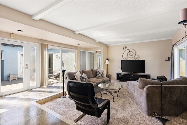 living room with beamed ceiling and tile patterned flooring