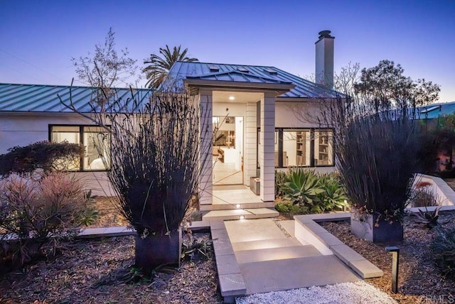 132628 Rainbow Ridge Ln, Encinitas, CA 92024 - doorway to property with a standing seam roof, metal roof, and a chimney