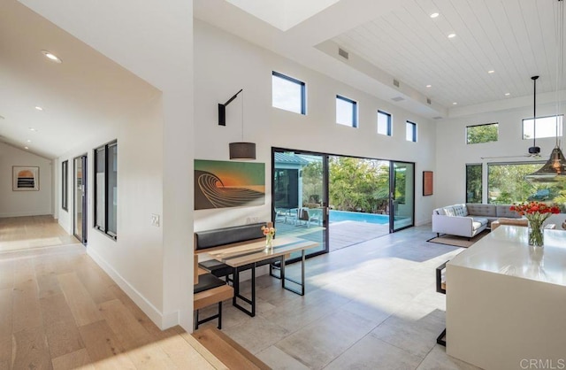 132628 Rainbow Ridge Ln, Encinitas, CA 92024 - living room featuring recessed lighting, a towering ceiling, plenty of natural light, light wood-style floors, and baseboards