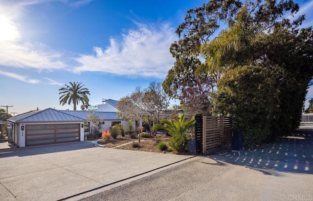 132628 Rainbow Ridge Ln, Encinitas, CA 92024 - view of front of house featuring concrete driveway, a standing seam roof, and metal roof