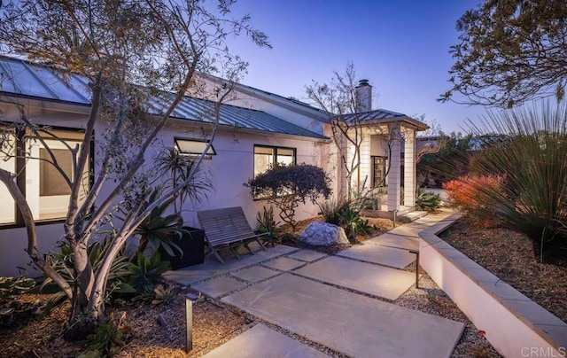 132628 Rainbow Ridge Ln, Encinitas, CA 92024 - view of front of home featuring a chimney, metal roof, and a patio area