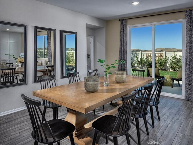 35368 Garcia St, Beaumont, CA 92223 - dining area featuring baseboards, wood finished floors, and a wealth of natural light