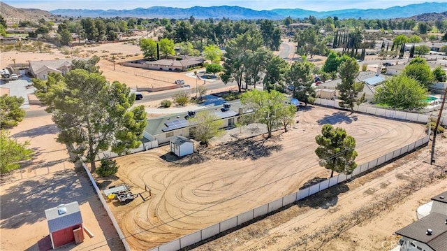 birds eye view of property with a mountain view