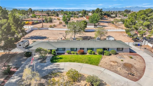 birds eye view of property with a mountain view