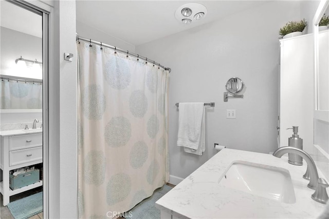full bathroom featuring vanity and curtained shower