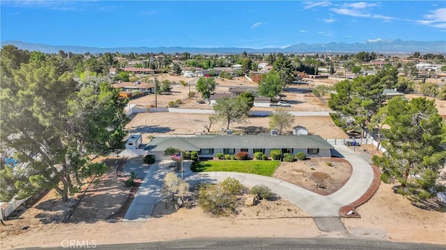 birds eye view of property featuring a mountain view