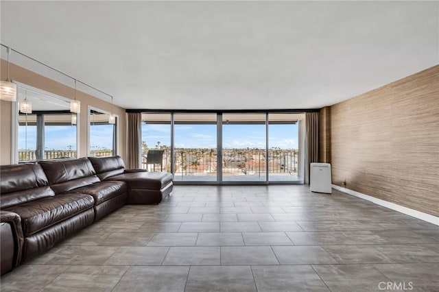 living room with expansive windows and a wealth of natural light