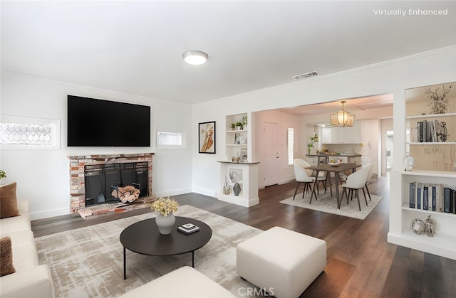 415 7th, Paso Robles, CA 93446 - living room with a fireplace with raised hearth, dark wood-style floors, visible vents, and baseboards